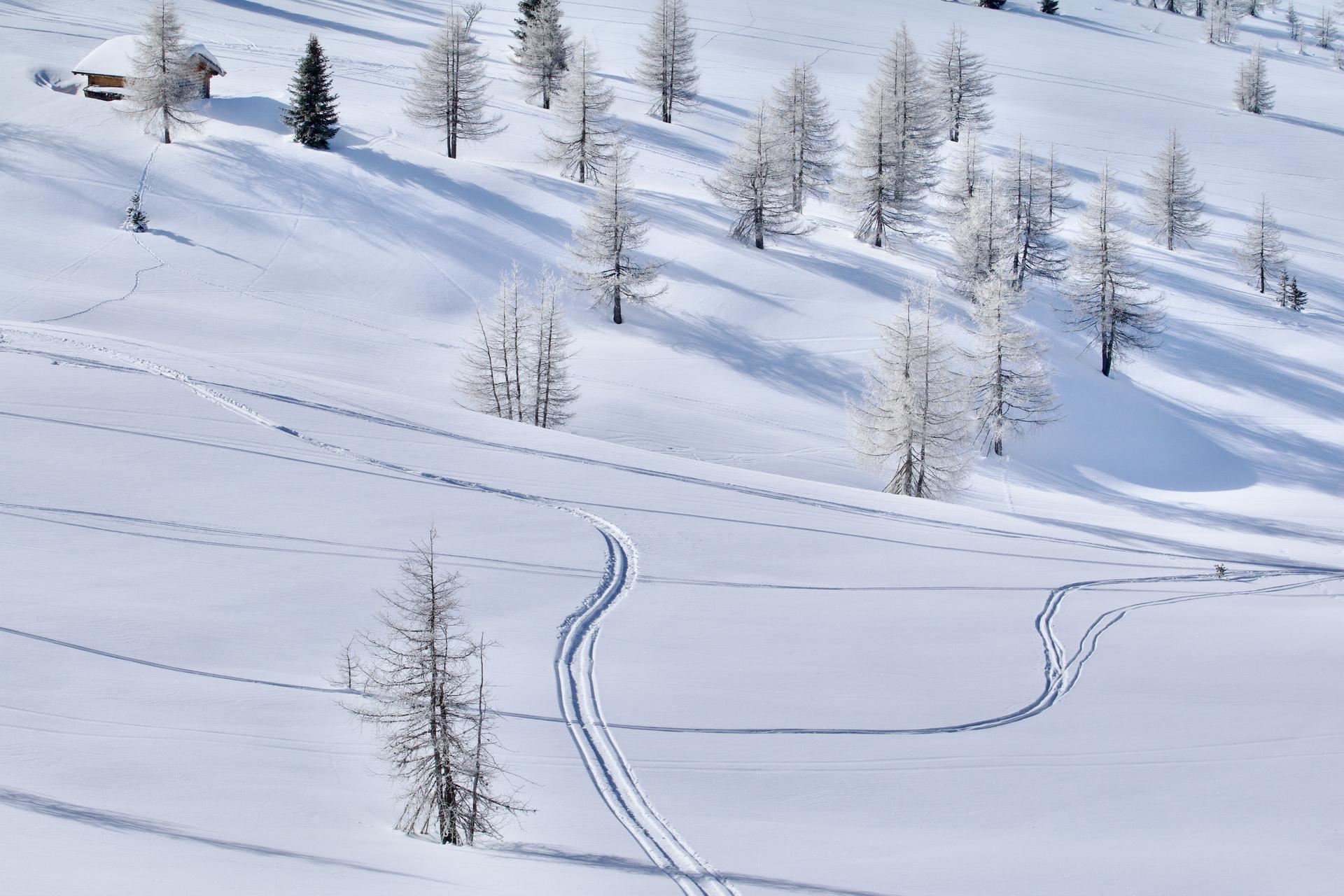 Snowtracks in snowy landscape in Italy